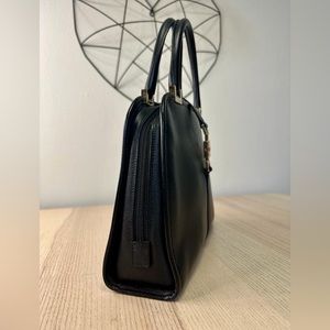 I only used it twice. Used like a new. Leather bag. Black color